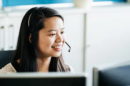 woman smiling on headset